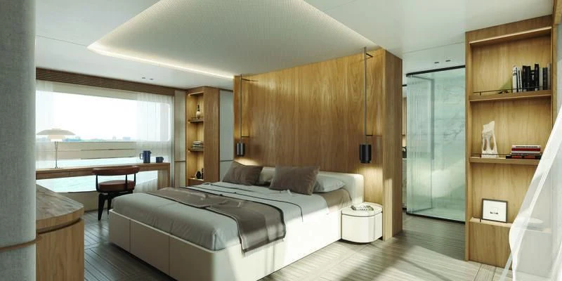 a bedroom with a bed and a desk aboard SEAESTA Yacht for Sale