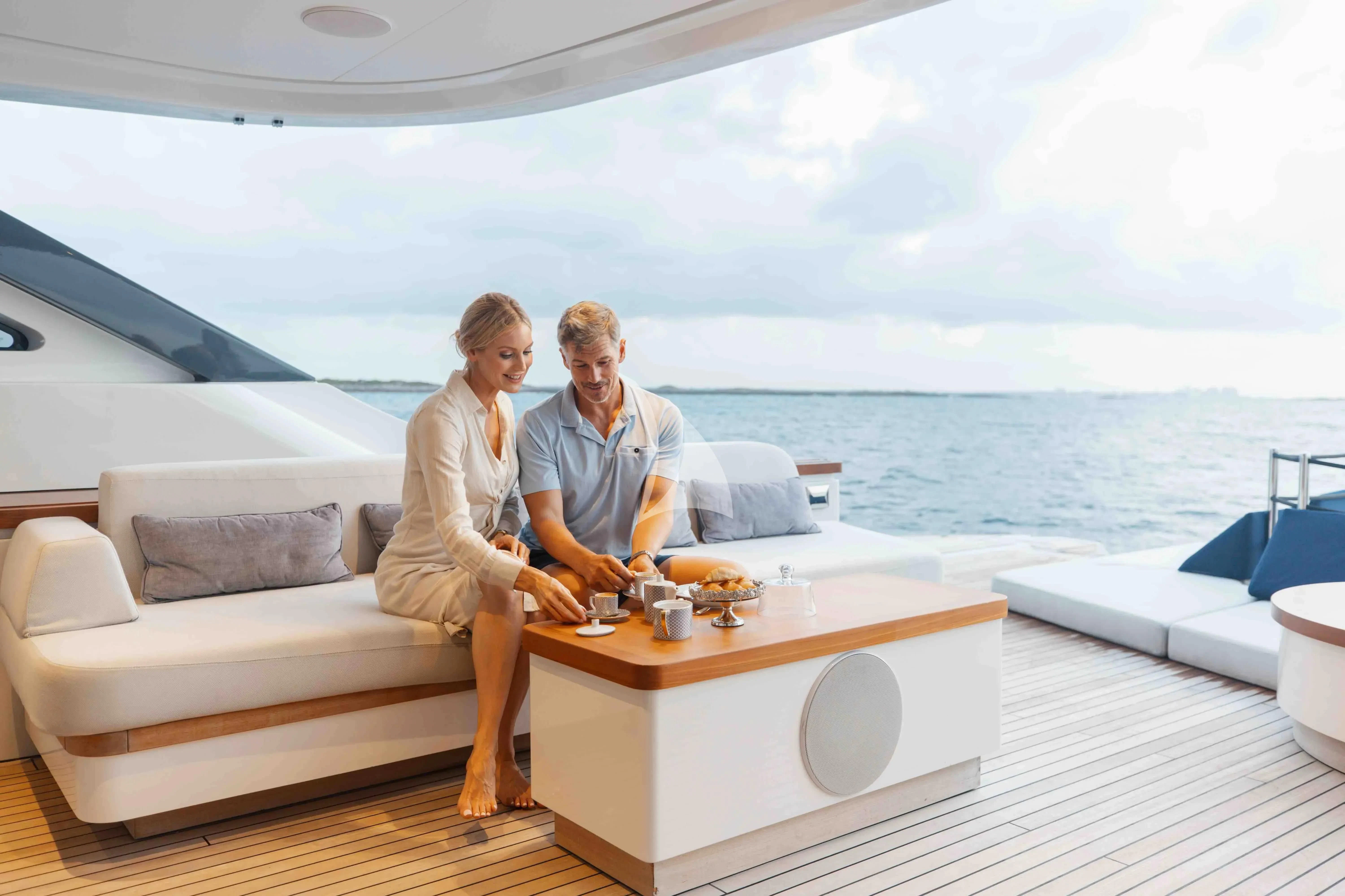 a couple sitting on a boat aboard SEAESTA Yacht for Sale