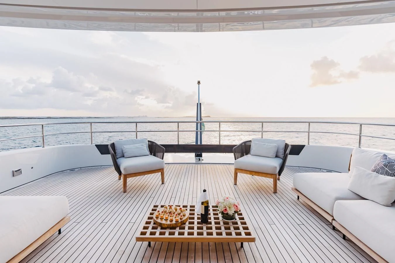 a room with a table chairs and a large body of water aboard SEAESTA Yacht for Sale