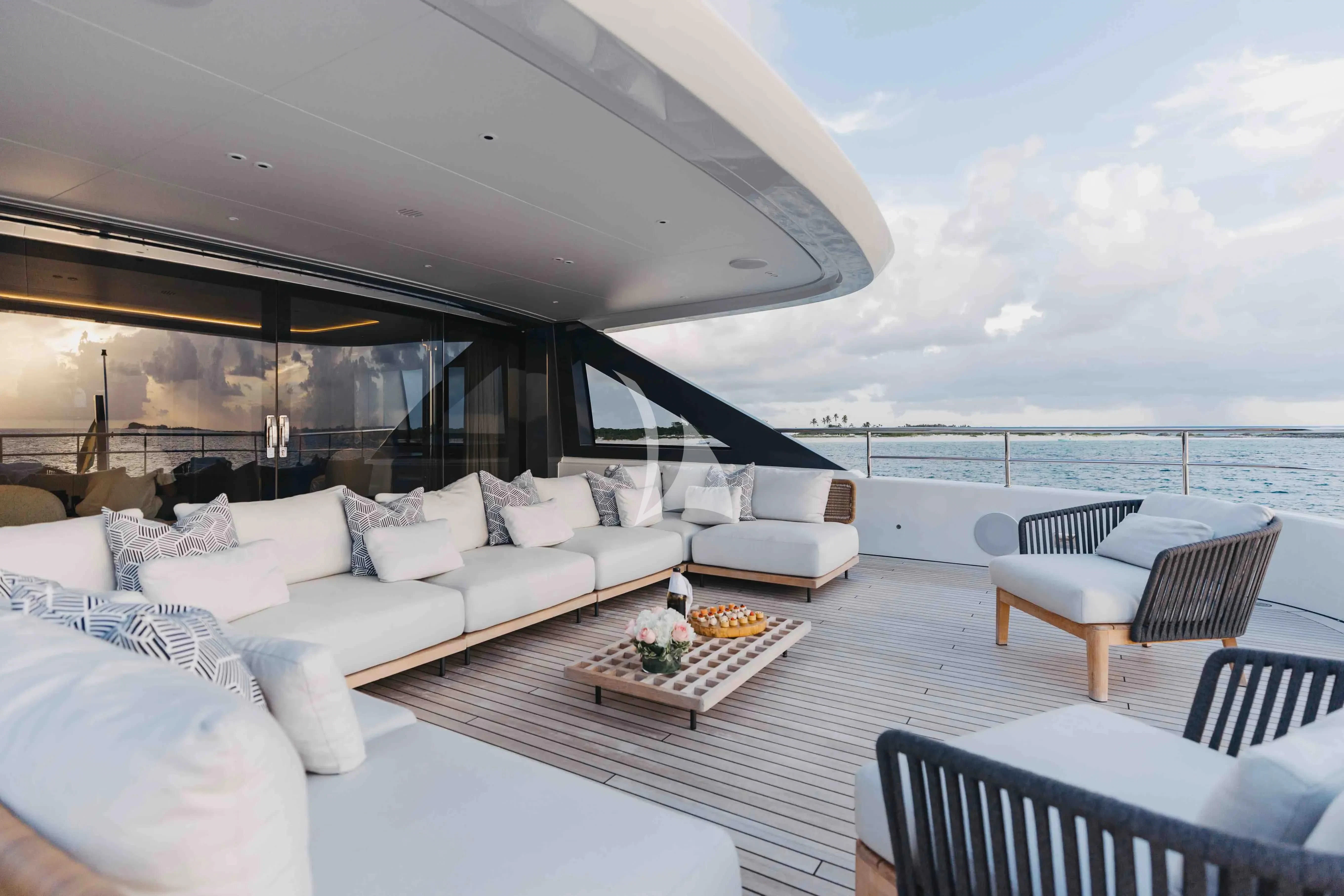 a living room with a large balcony aboard SEAESTA Yacht for Sale