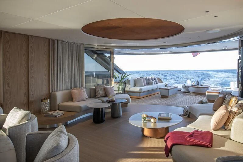 a living room with a large patio aboard SEAESTA Yacht for Sale