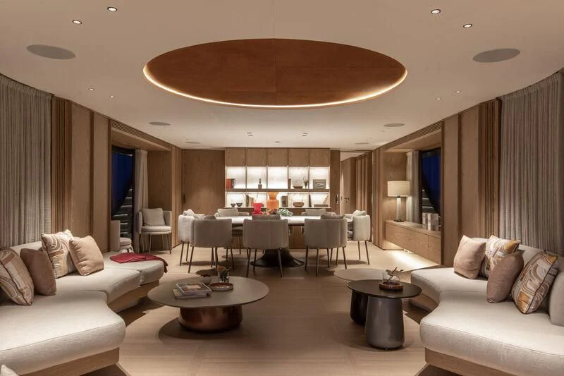 a living room with a large chandelier aboard SEAESTA Yacht for Sale