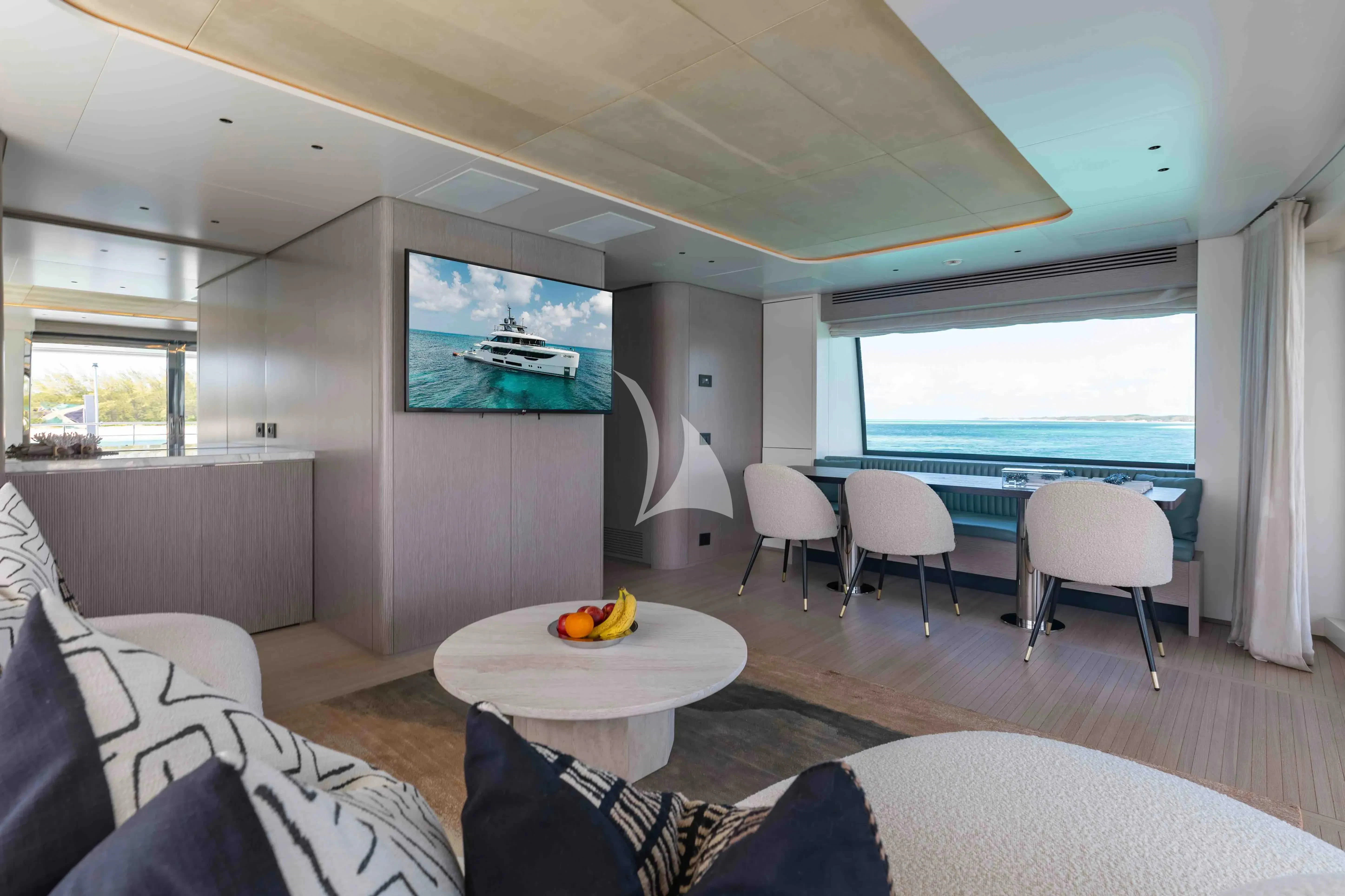 a living room with a large television aboard SEAESTA Yacht for Sale