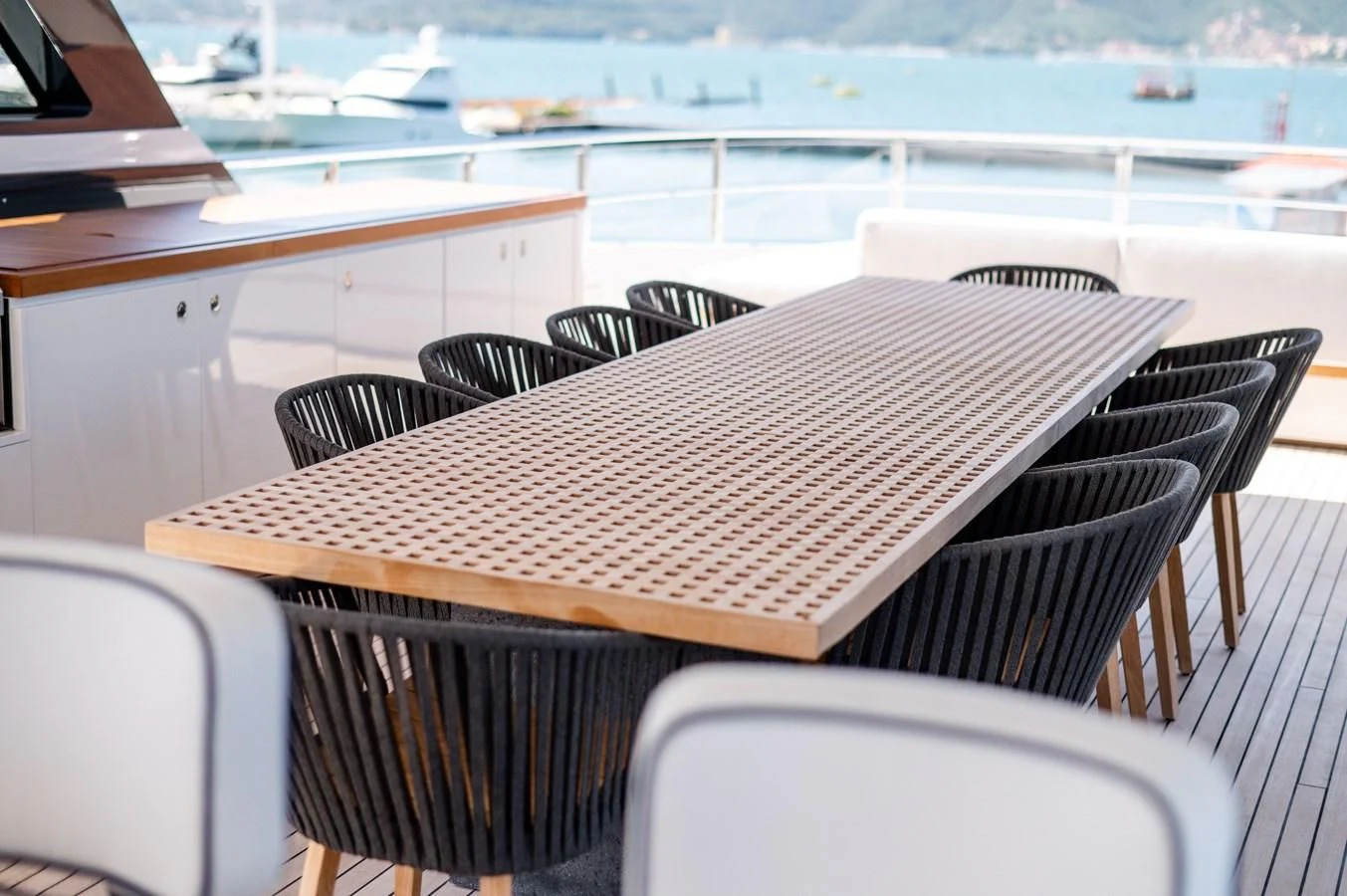 a table and chairs on a balcony aboard SEAESTA Yacht for Sale
