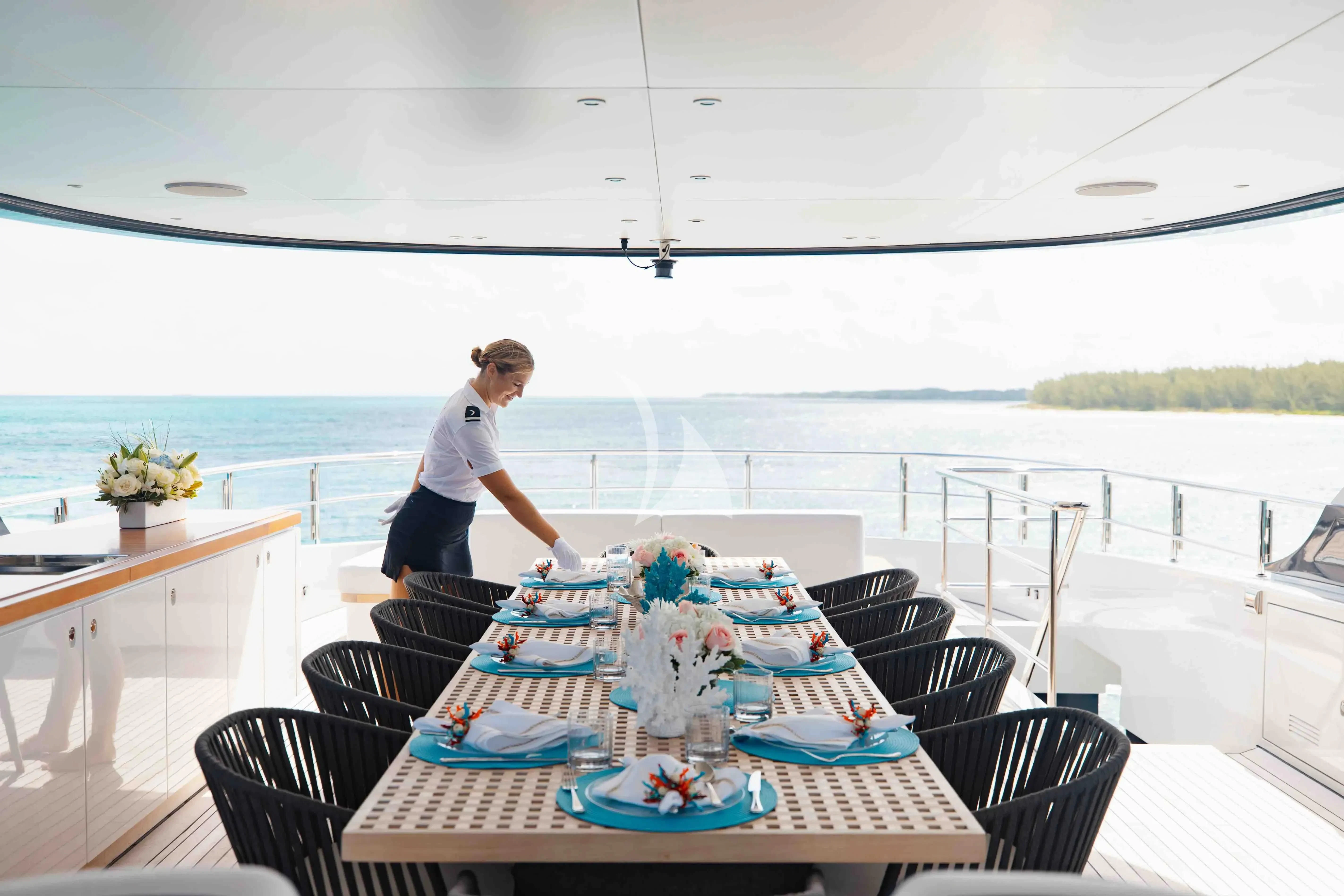 a person standing on a deck aboard SEAESTA Yacht for Sale