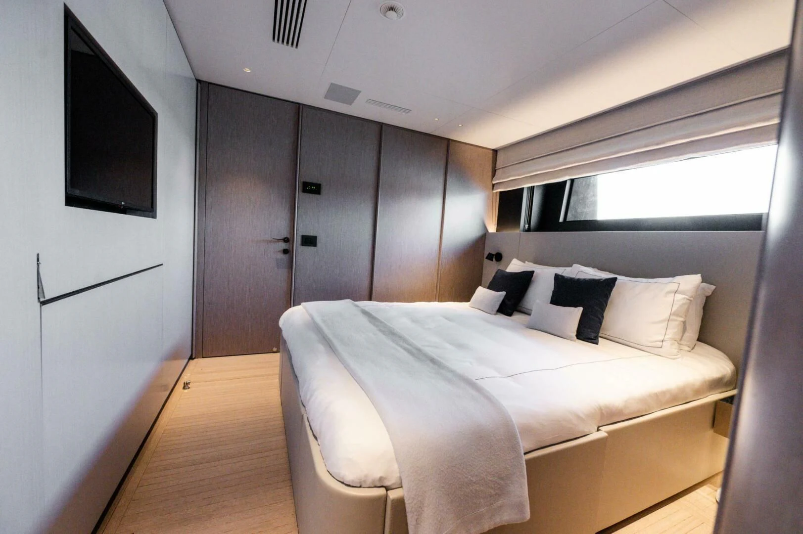 a room with a bed and a television aboard SEAESTA Yacht for Sale
