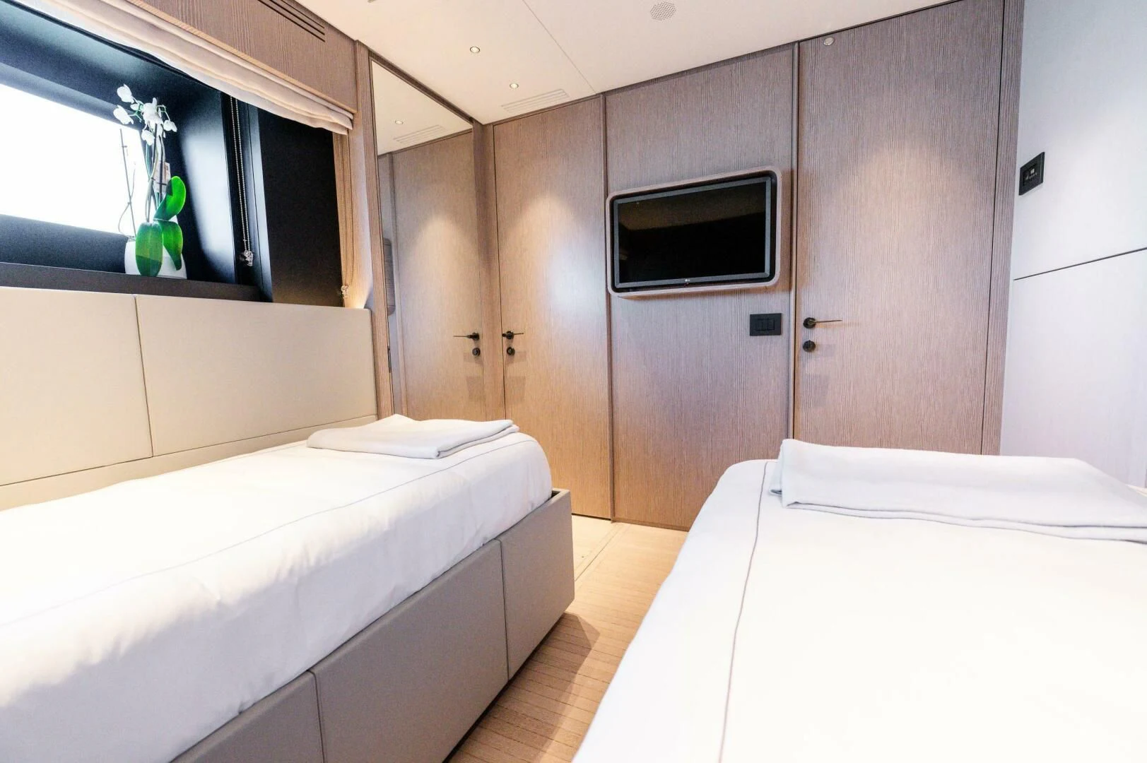 a room with a bed and a television aboard SEAESTA Yacht for Sale