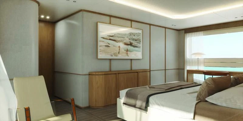 a room with a bed and a chair aboard SEAESTA Yacht for Sale
