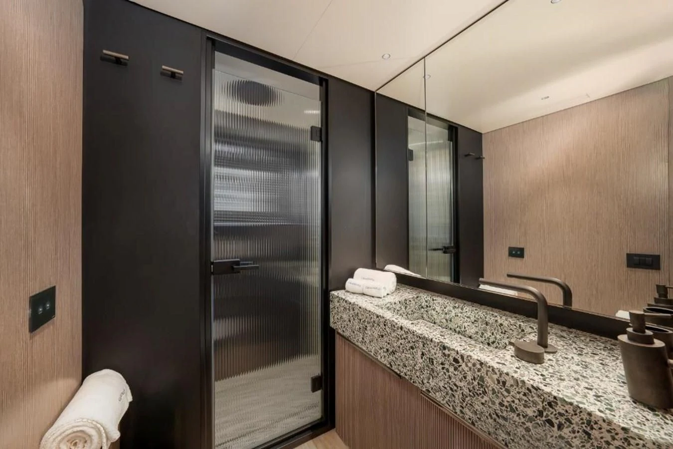 a bathroom with a marble counter top aboard SEAESTA Yacht for Sale