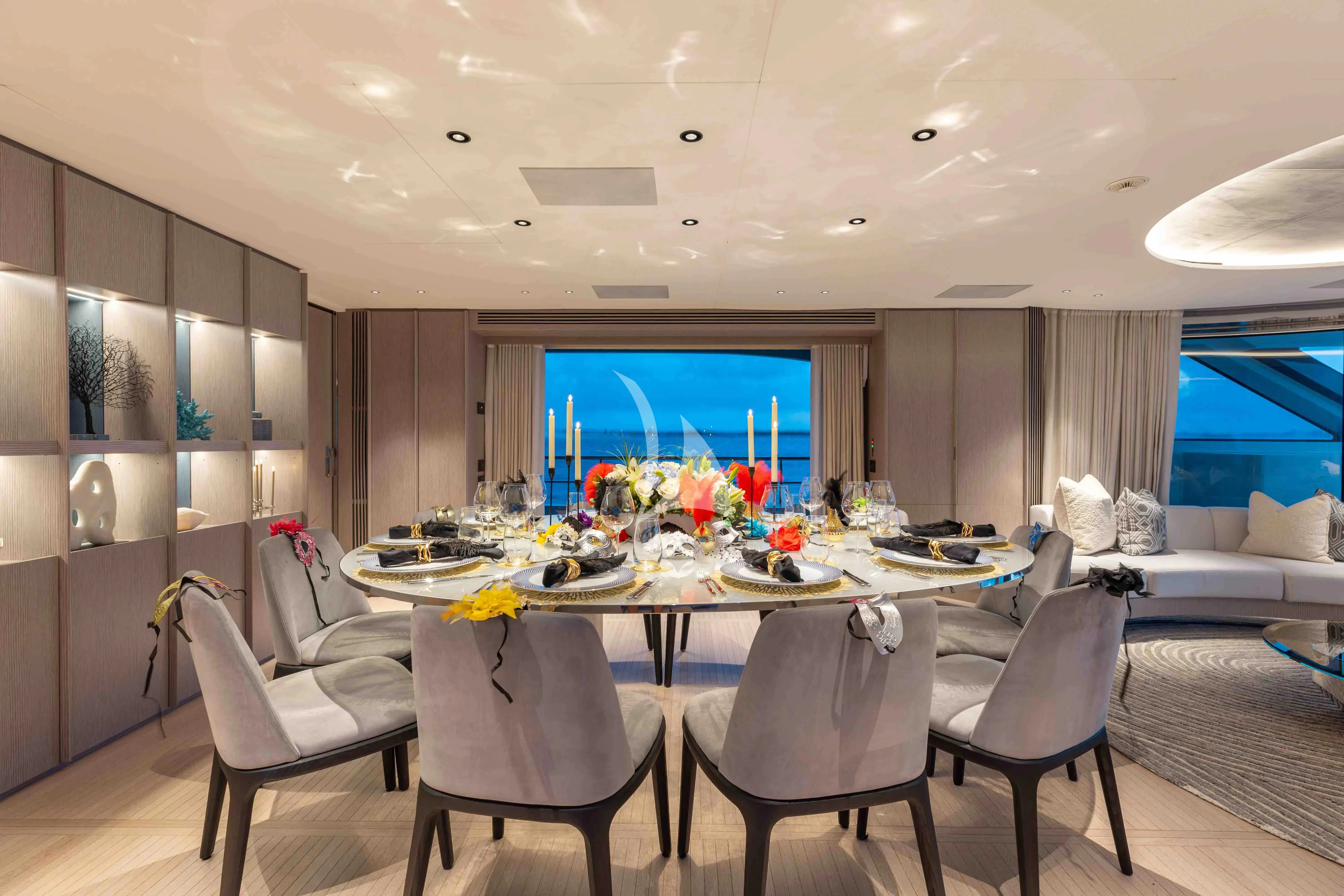 a large room with a table and chairs aboard SEAESTA Yacht for Sale