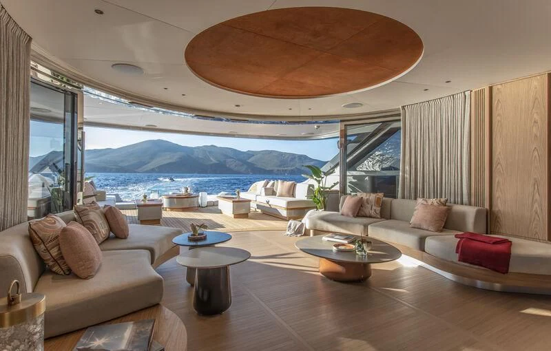 a living room with a large window aboard SEAESTA Yacht for Sale