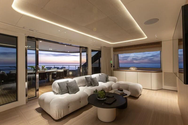 a living room with a large screen aboard SEAESTA Yacht for Sale