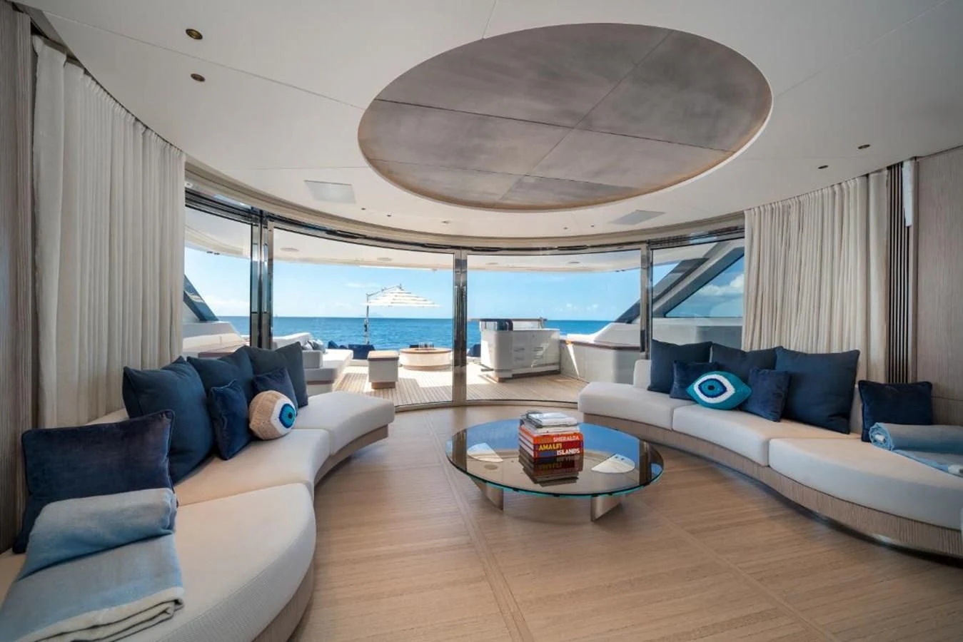 a living room with a large patio aboard SEAESTA Yacht for Sale
