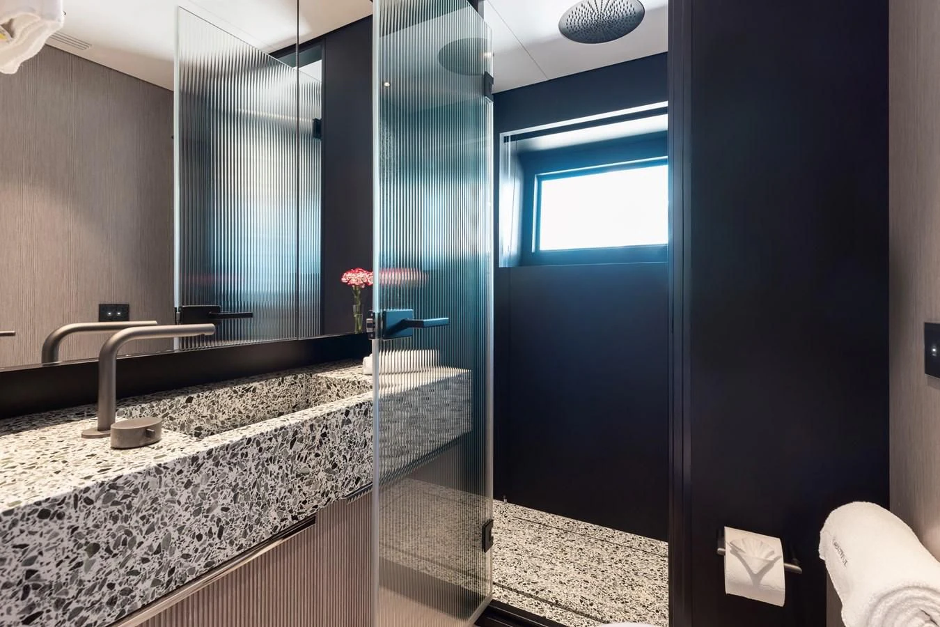 a bathroom with a marble counter top aboard SEAESTA Yacht for Sale