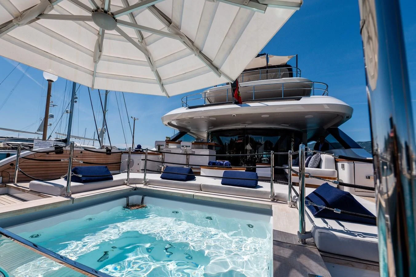 a couple of boats sit near a pool aboard SEAESTA Yacht for Sale