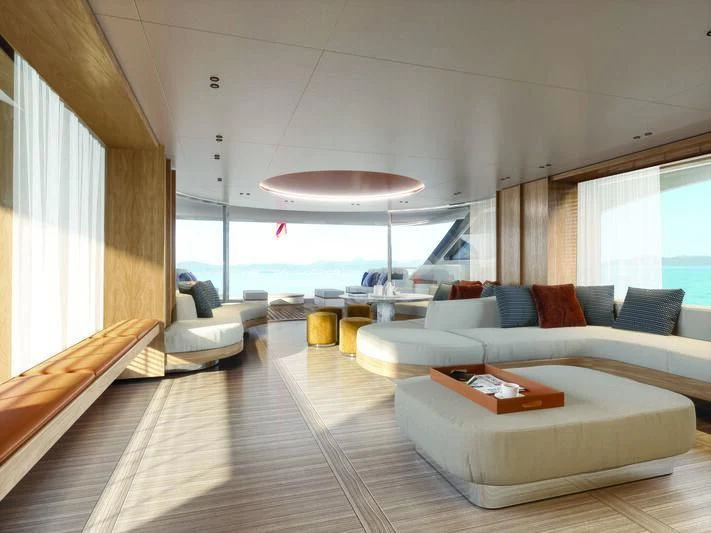 a room with a large window and a large sofa aboard SEAESTA Yacht for Sale