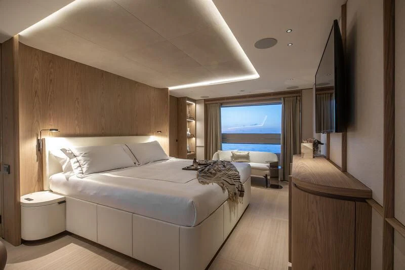 a room with a bed and a tv aboard SEAESTA Yacht for Sale