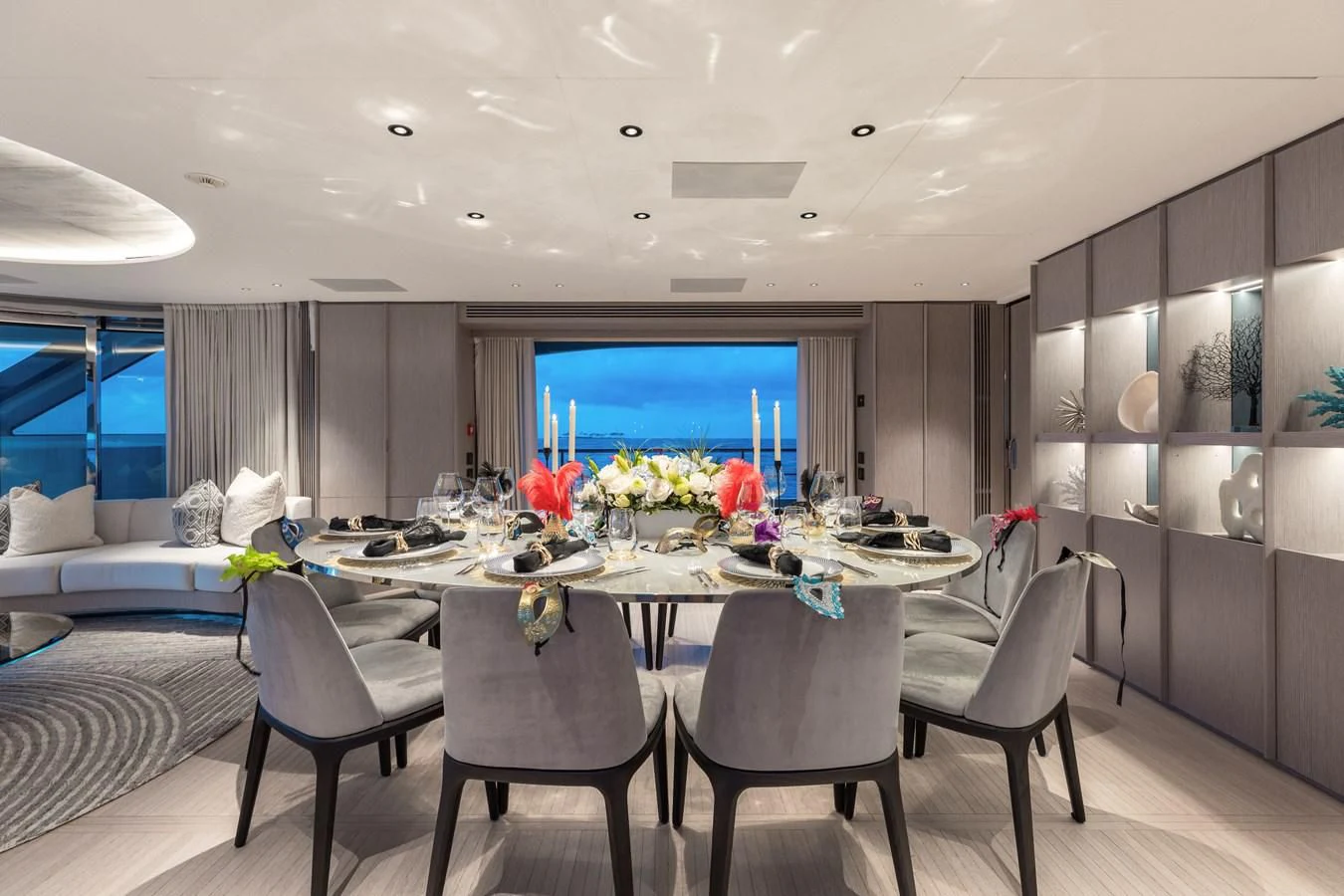 a large room with a table and chairs aboard SEAESTA Yacht for Sale