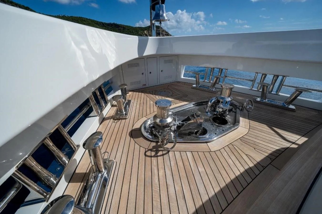 a large balcony with a table and chairs on it aboard SEAESTA Yacht for Sale