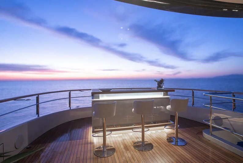 a balcony overlooking a body of water aboard SEAESTA Yacht for Sale
