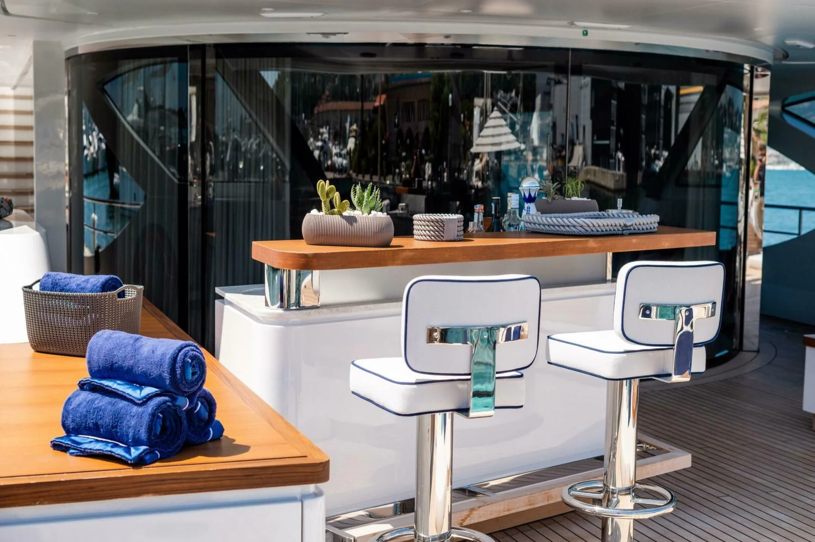 a table with chairs and a glass case aboard SEAESTA Yacht for Sale