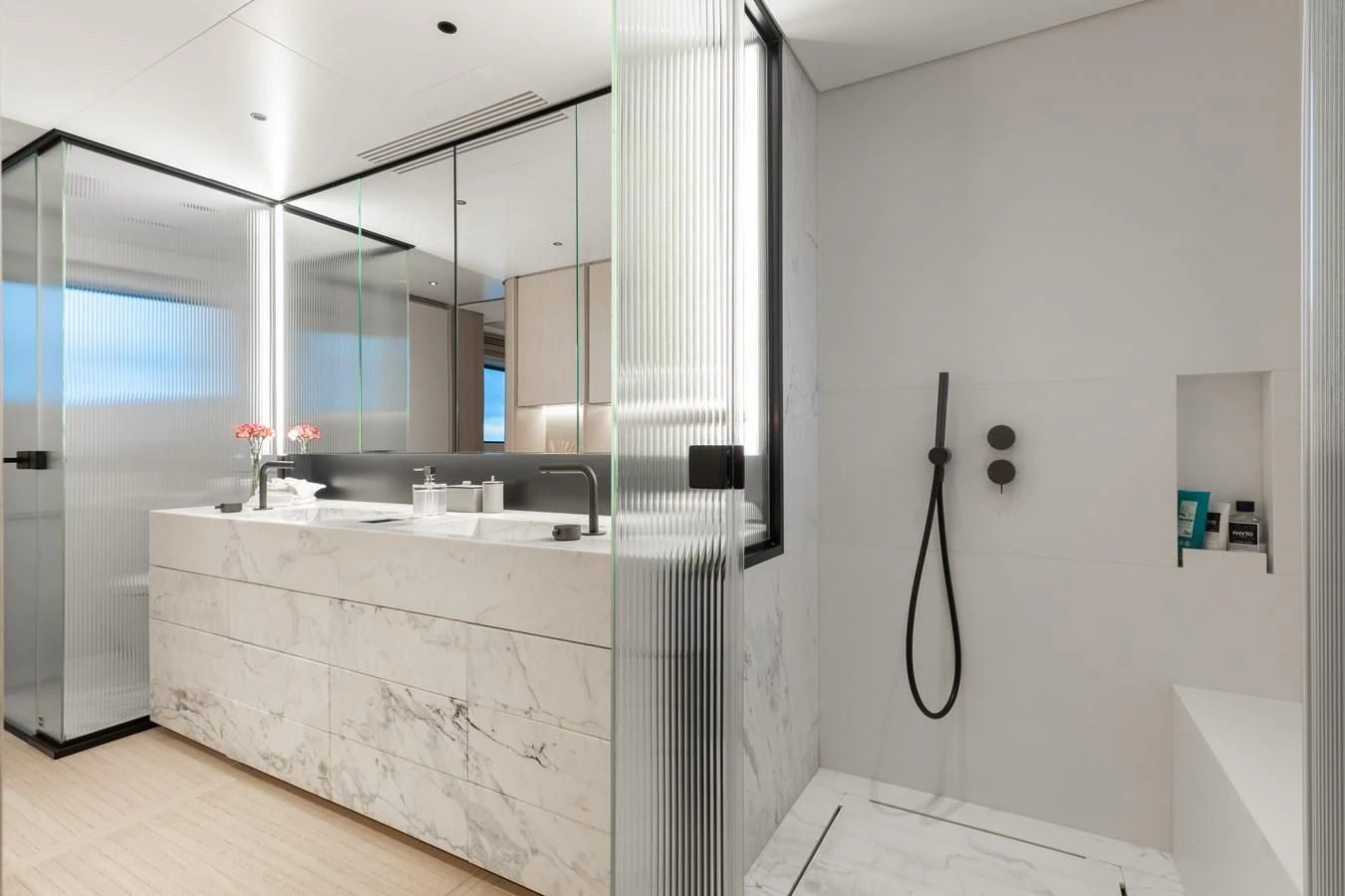 a bathroom with a sink and shower aboard SEAESTA Yacht for Sale