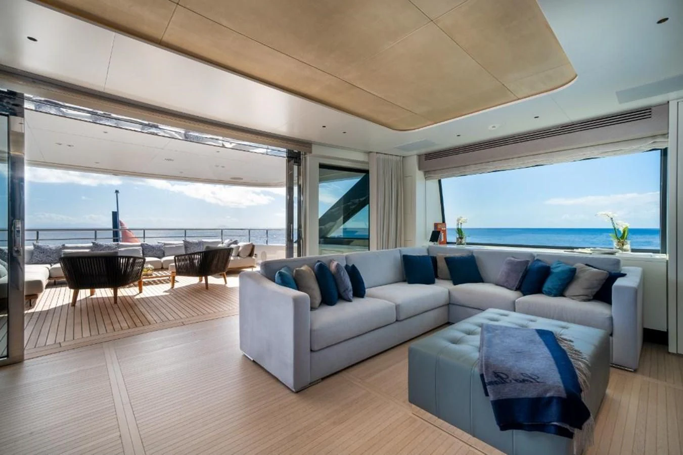 a living room with a large window aboard SEAESTA Yacht for Sale