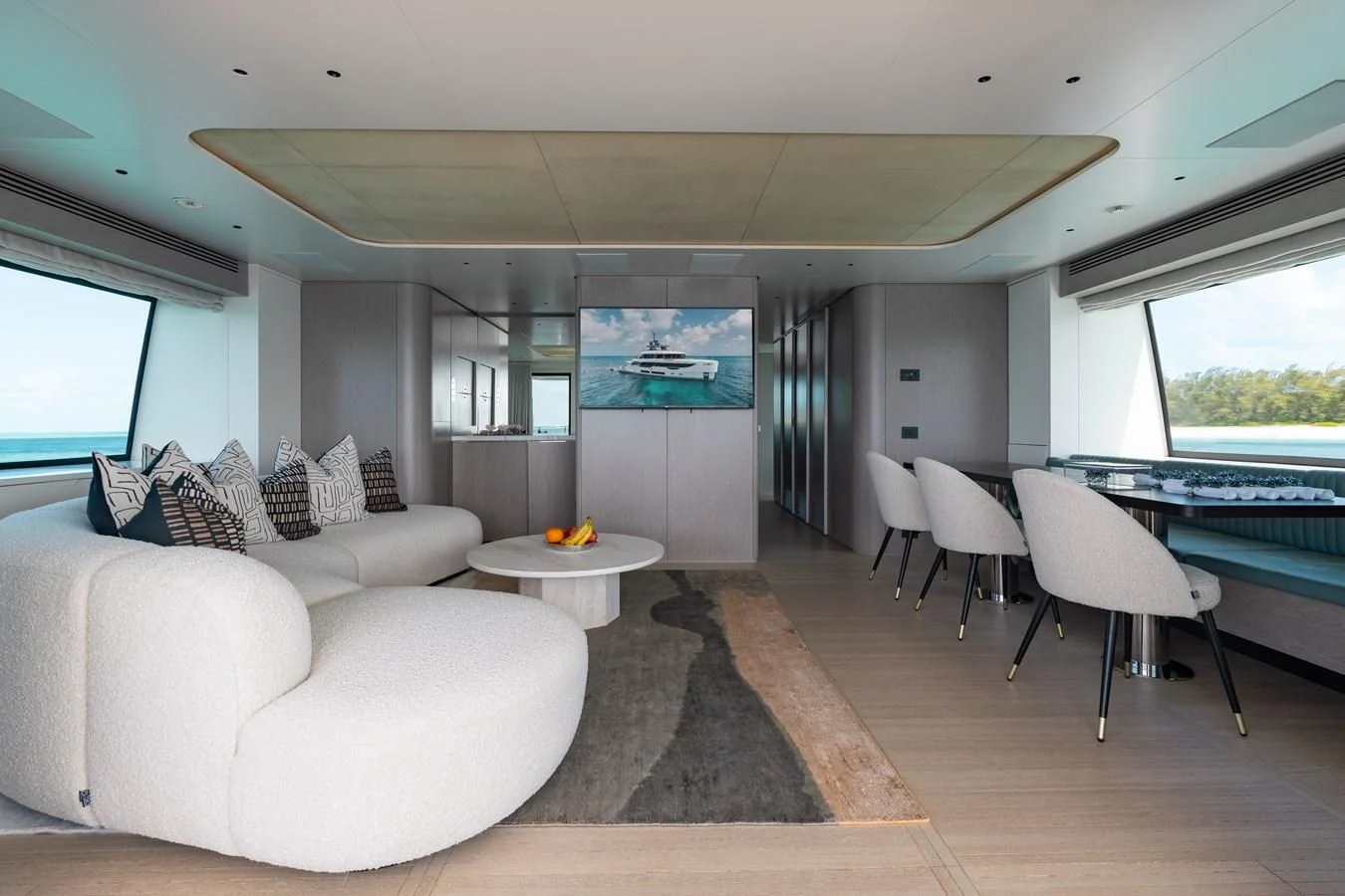 a living room with a couch and a table aboard SEAESTA Yacht for Sale