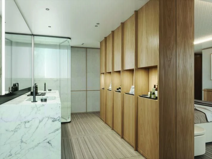 a bathroom with a tub and wooden cabinets aboard SEAESTA Yacht for Sale