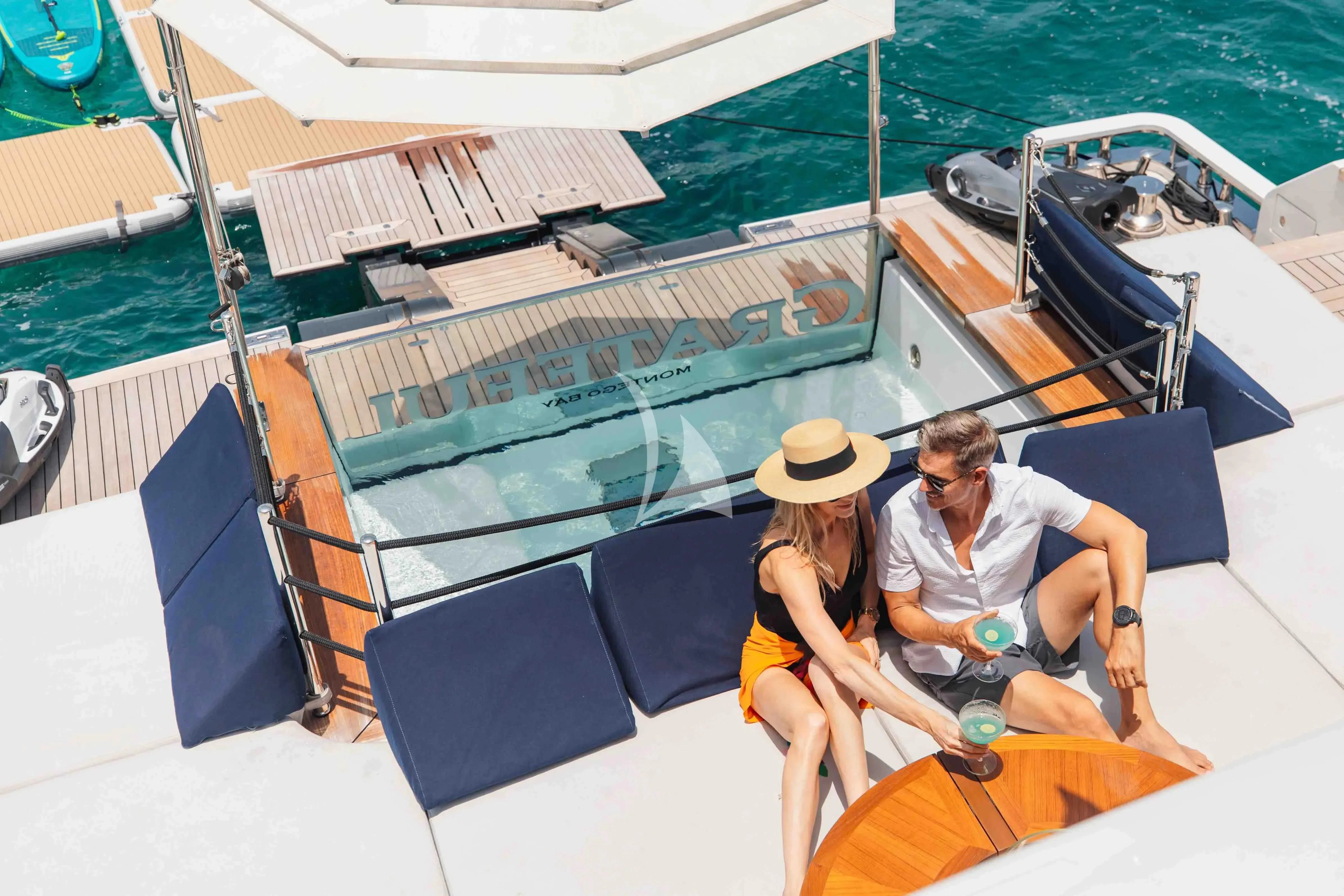 a couple sitting on a boat aboard SEAESTA Yacht for Sale