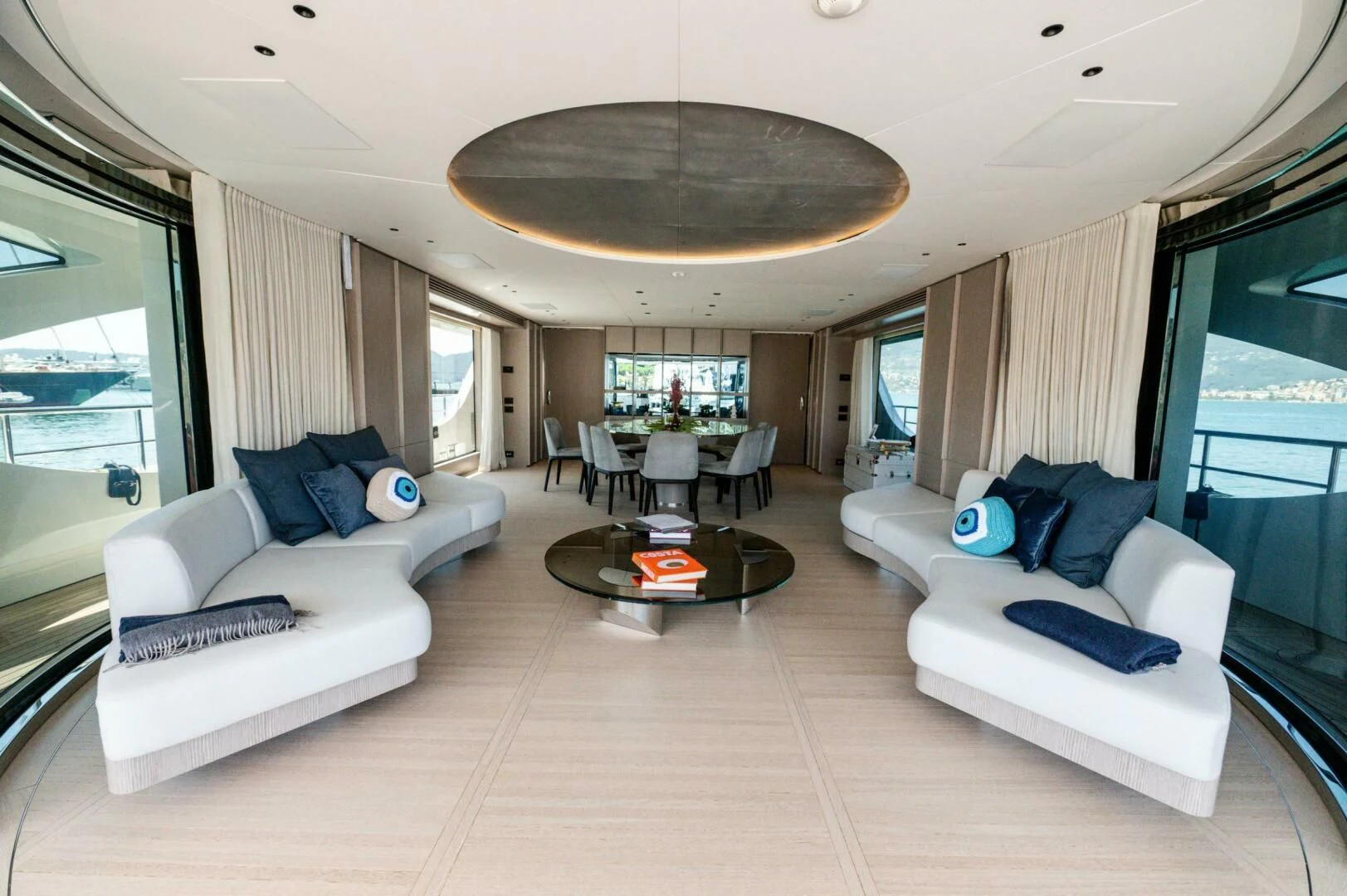 a living room with white couches aboard SEAESTA Yacht for Sale