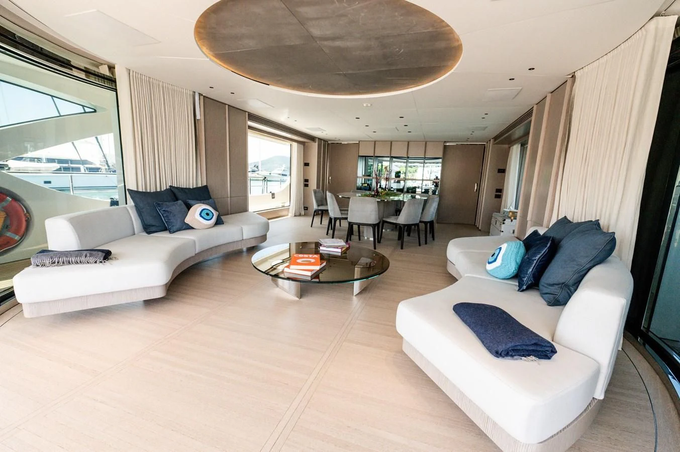 a living room with a couch and a table aboard SEAESTA Yacht for Sale