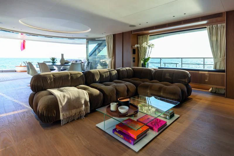 a living room with a couch and coffee table aboard SEAESTA Yacht for Sale
