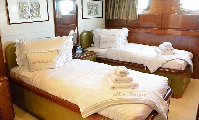 a couple of beds in a hotel room aboard WHITE KNIGHT Yacht for Sale