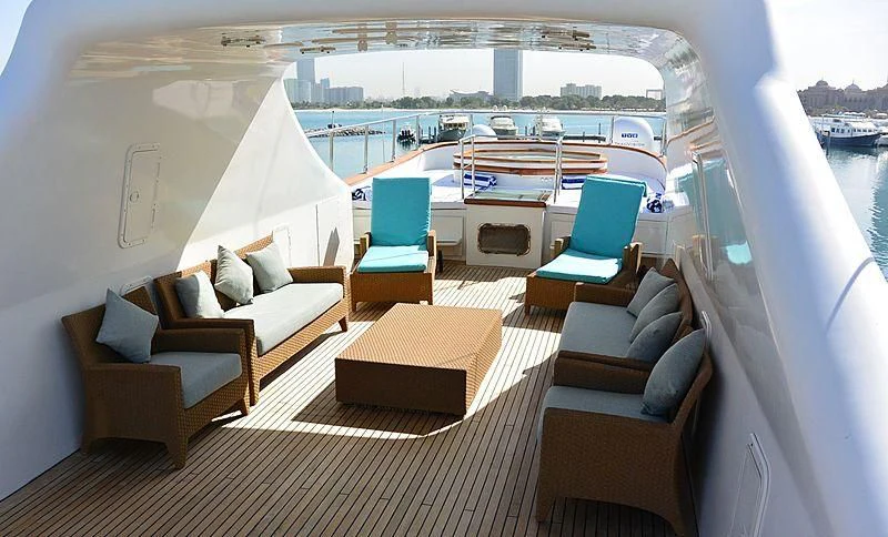 a room with a bed and a couch aboard WHITE KNIGHT Yacht for Sale