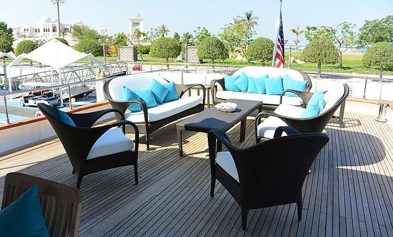 a table and chairs on a deck aboard WHITE KNIGHT Yacht for Sale