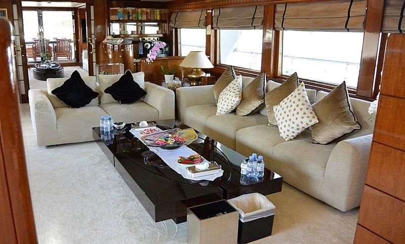 a living room with a couch and a coffee table aboard WHITE KNIGHT Yacht for Sale