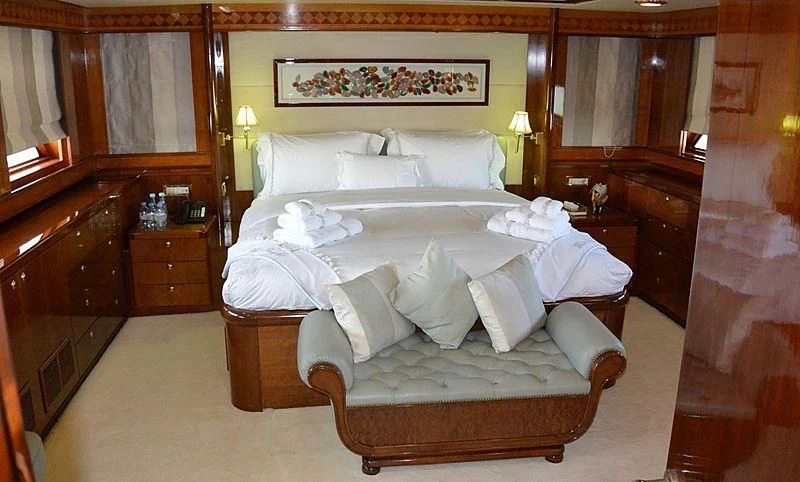 a bed with white sheets aboard WHITE KNIGHT Yacht for Sale