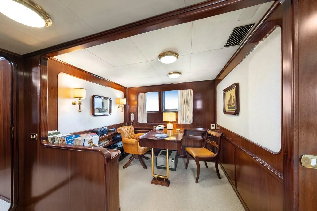 a room with a table and chairs aboard ATHINA Yacht for Sale
