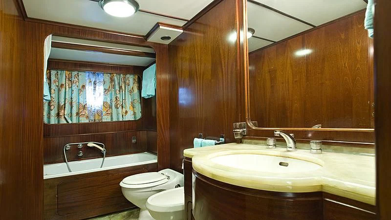 a bathroom with a sink toilet and bathtub aboard ATHINA Yacht for Sale