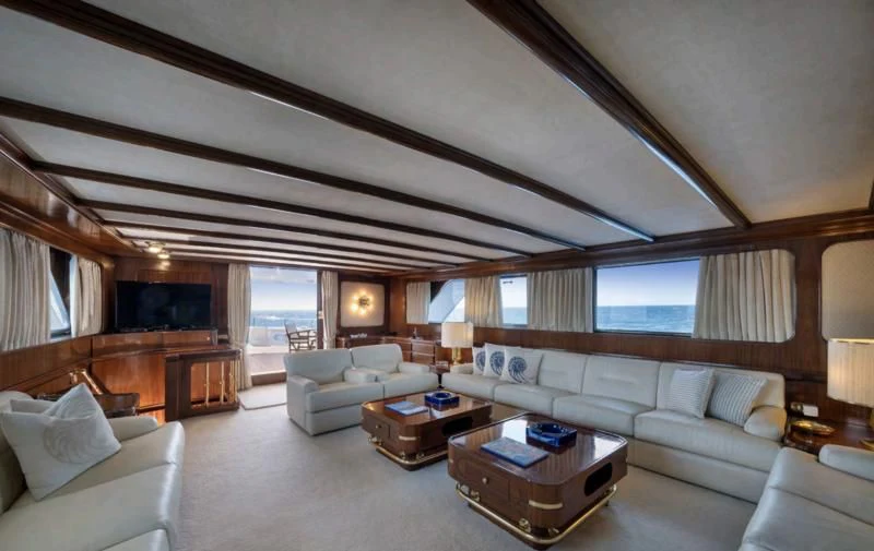 a living room with a couch and a coffee table aboard ATHINA Yacht for Sale