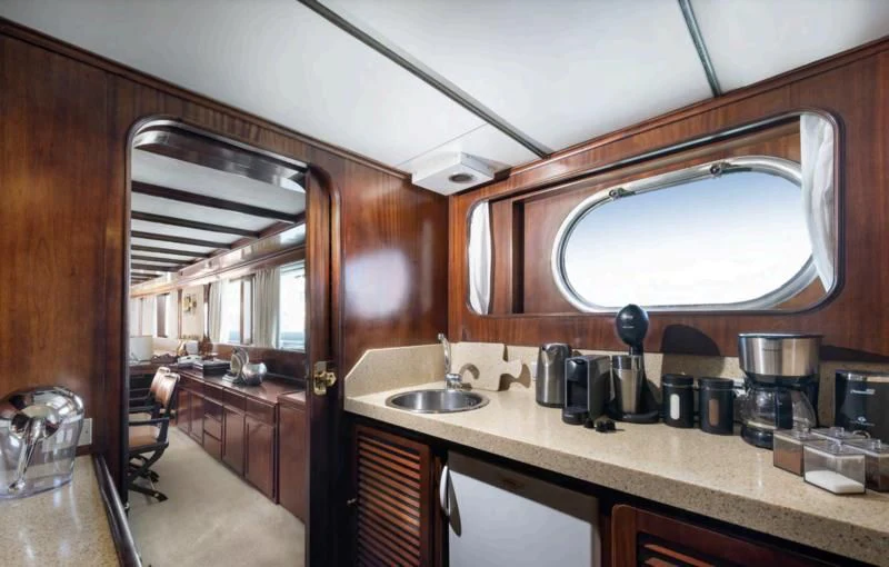 a kitchen with a large mirror aboard ATHINA Yacht for Sale