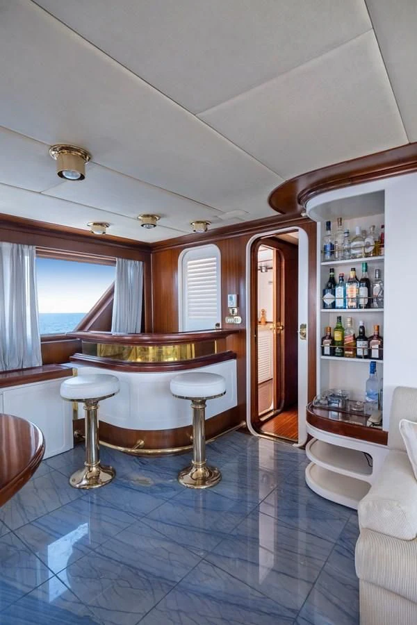 a room with a table and chairs aboard ATHINA Yacht for Sale