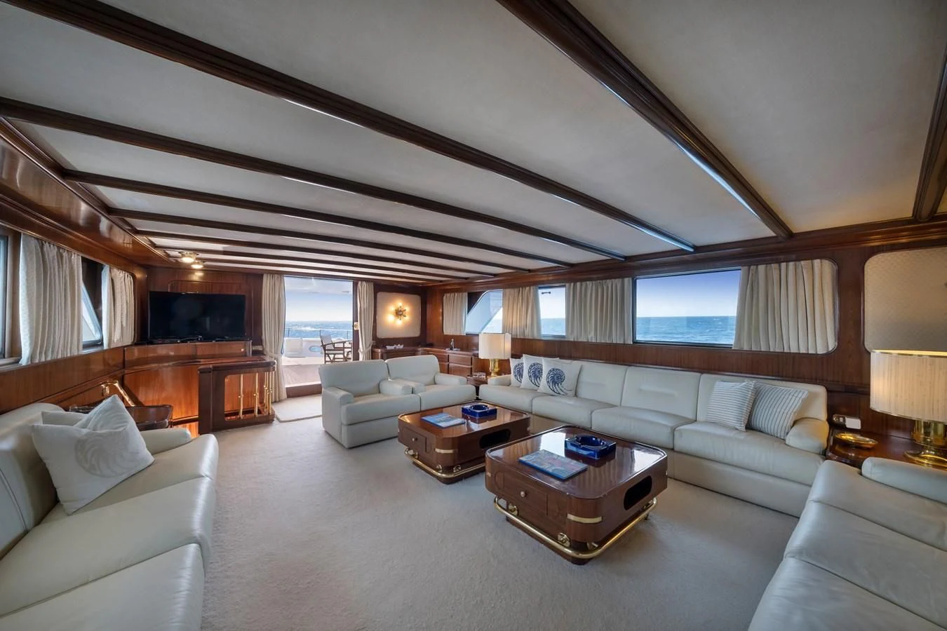 a living room with a large window aboard ATHINA Yacht for Sale