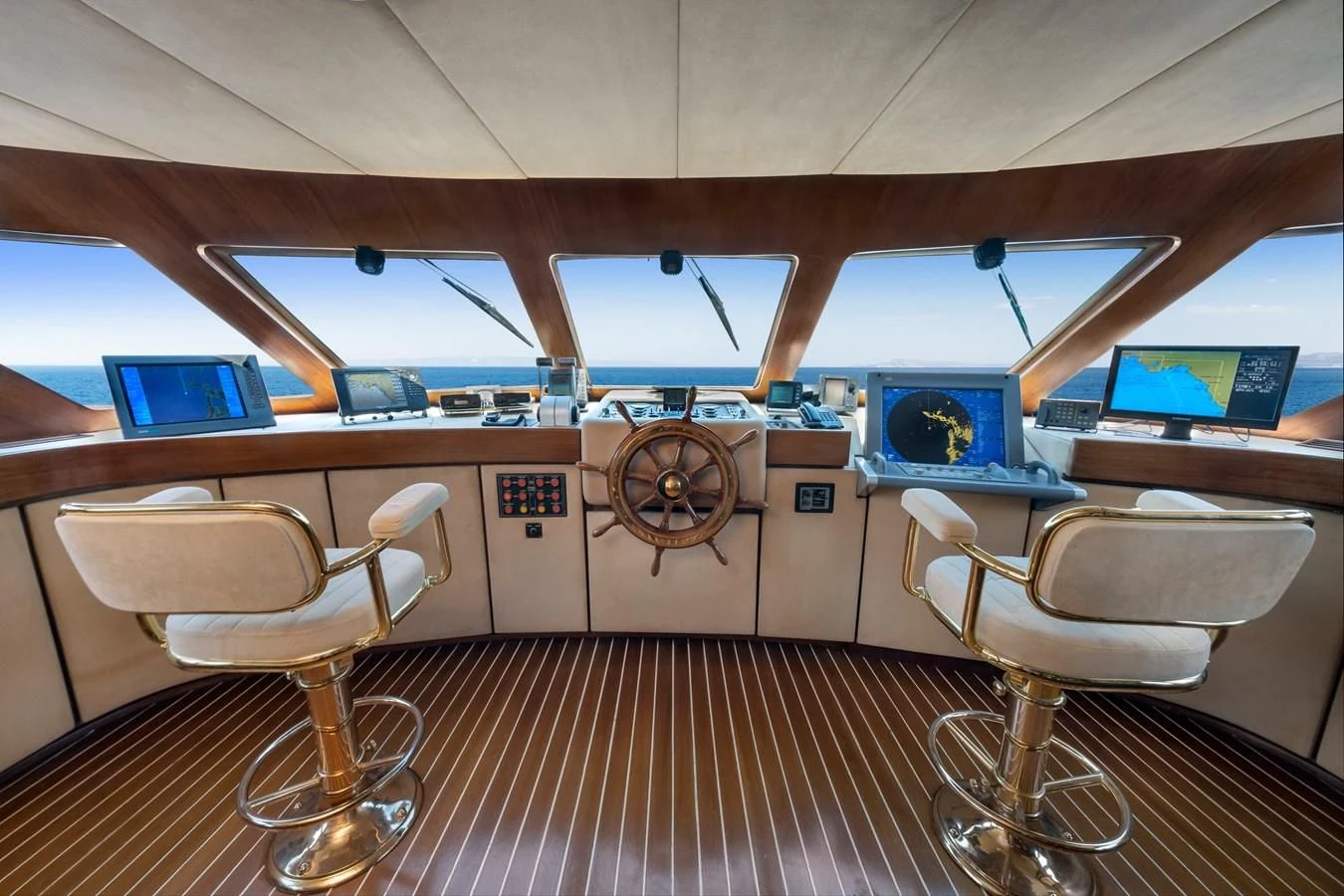 inside of a vehicle with chairs and desks aboard ATHINA Yacht for Sale