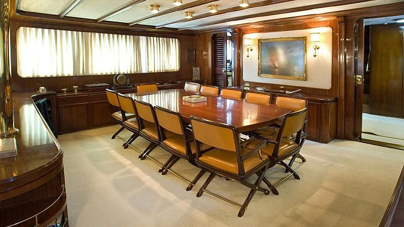 a conference room with a table and chairs aboard ATHINA Yacht for Sale