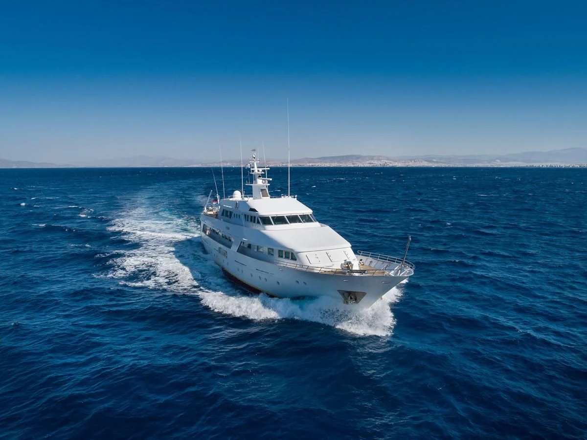 a white boat in the water aboard ATHINA Yacht for Sale