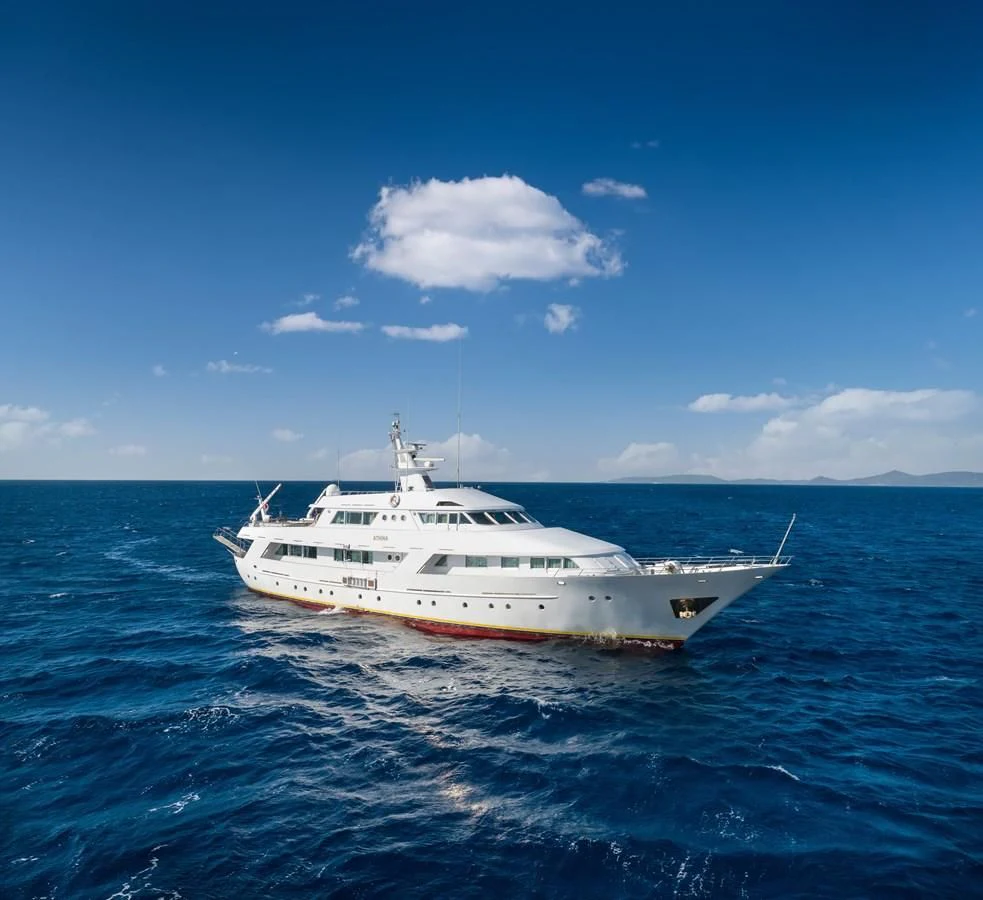 a white yacht in the water aboard ATHINA Yacht for Sale