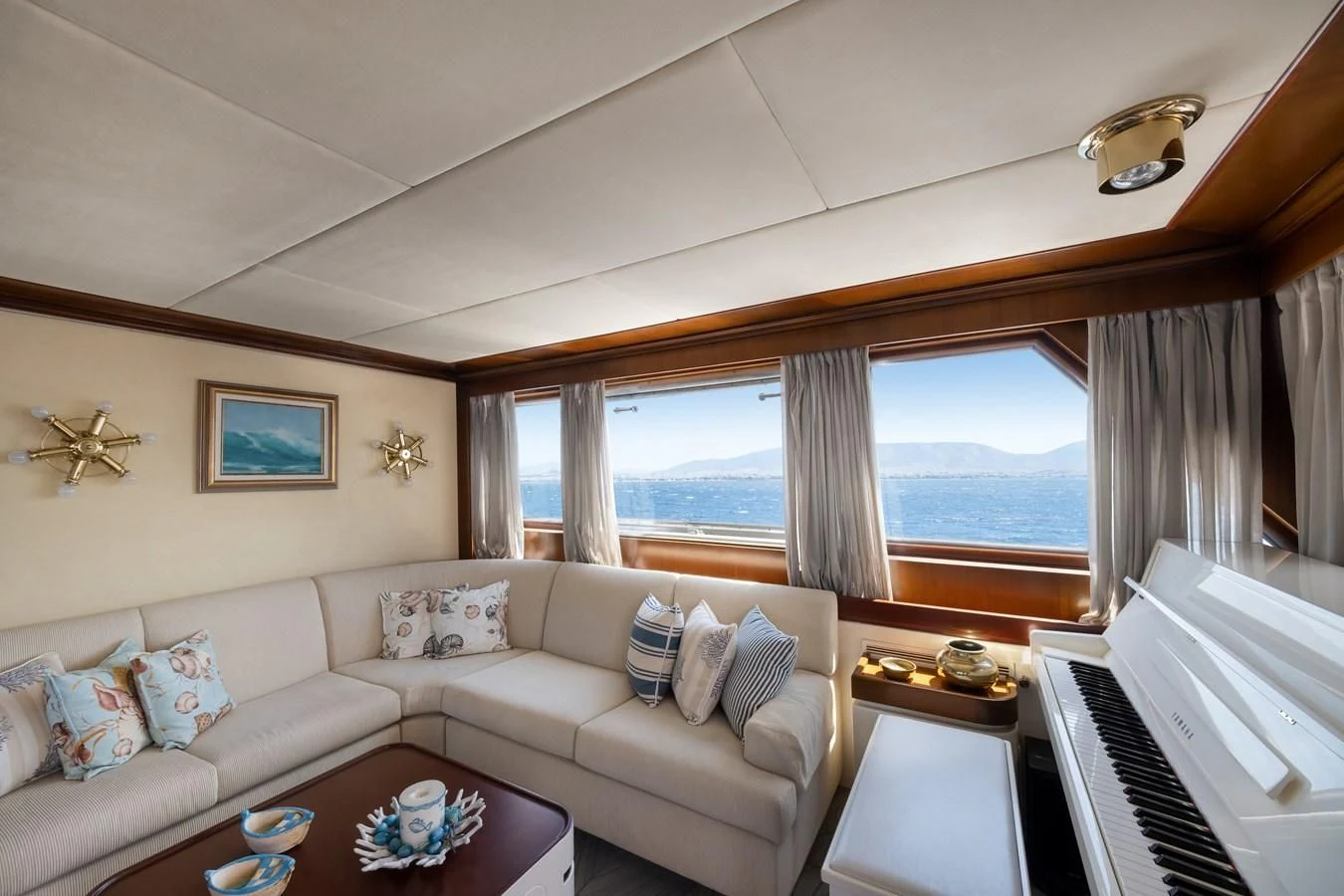 a living room with a piano aboard ATHINA Yacht for Sale