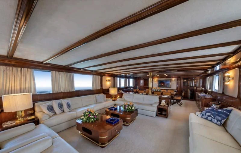 a large living room with a large ceiling aboard ATHINA Yacht for Sale